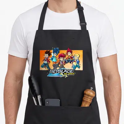 Tablier de cuisine noir avec Bel Hyuga, Hikaru Dante et le logo Beyblade Burst coloré.