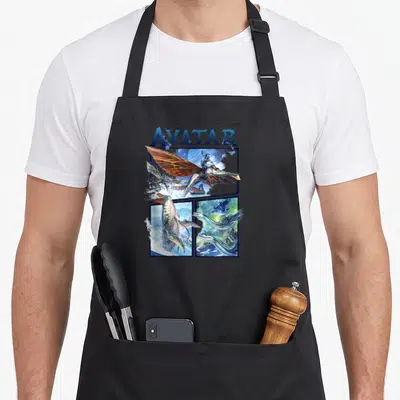 Tablier de cuisine noir avec illustration d'Avatar montrant un cavalier sur Ikaru et des scènes marines en panneaux.