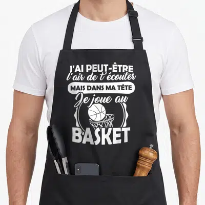 Tablier de cuisine noir avec inscription blanche sur le basketball et illustration d'un ballon entrant dans un panier.
