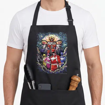 Tablier de cuisine noir avec illustration du Megazord et des Power Rangers sur fond tourbillonnant.