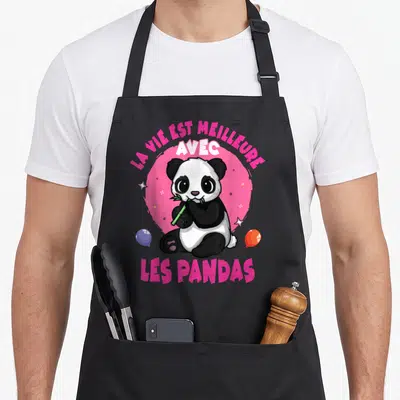 Tablier de cuisine noir avec un panda cartoon mangeant du bambou et des ballons colorés.