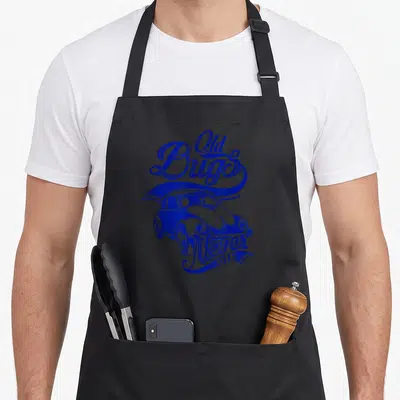 Tablier de cuisine noir avec illustration bleue d'une coccinelle vintage et texte Old Bugs Never Die.