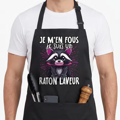 Tablier de cuisine noir avec un raton laveur mignon aux oreilles roses et le texte Je m'en fous je suis un raton laveur.