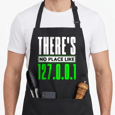 Tablier de cuisine noir avec inscription blanche et verte There's No Place Like 127.0.0.1 Admin Réseau