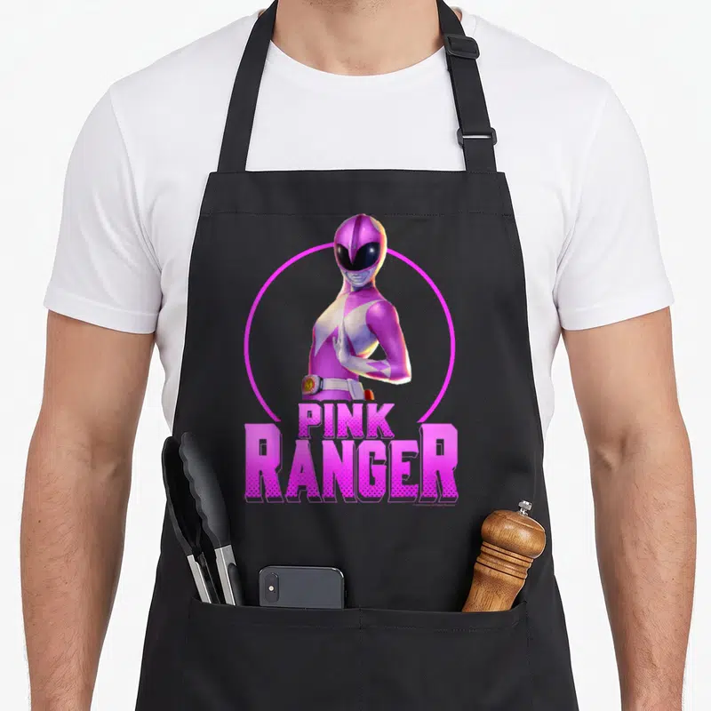 Tablier de cuisine noir avec le portrait du Pink Ranger et le texte Pink Ranger en rose vif.