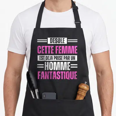 Tablier de cuisine noir avec inscription désolé cette femme est déjà prise par un homme fantastique en rose et blanc.
