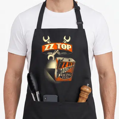 Tablier de cuisine noir avec illustration vintage d'un bidon de carburant et deux clés anglaises croisées au-dessus.