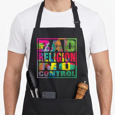 Tablier de cuisine noir avec inscription Bad Religion Sans contrôle en lettres colorées et effet dégradé géométrique.