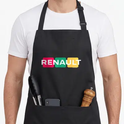 Tablier de cuisine noir avec logo Renault composé de trois blocs colorés rose vert et jaune traversés par le texte blanc RENAULT