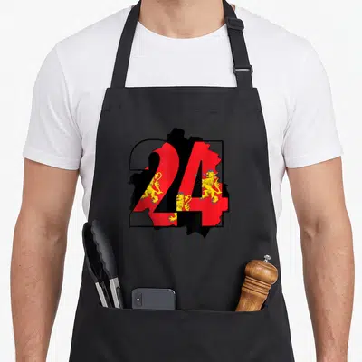 Tablier de cuisine noir avec le chiffre 24 et des lions dorés sur fond rouge représentant la Dordogne.