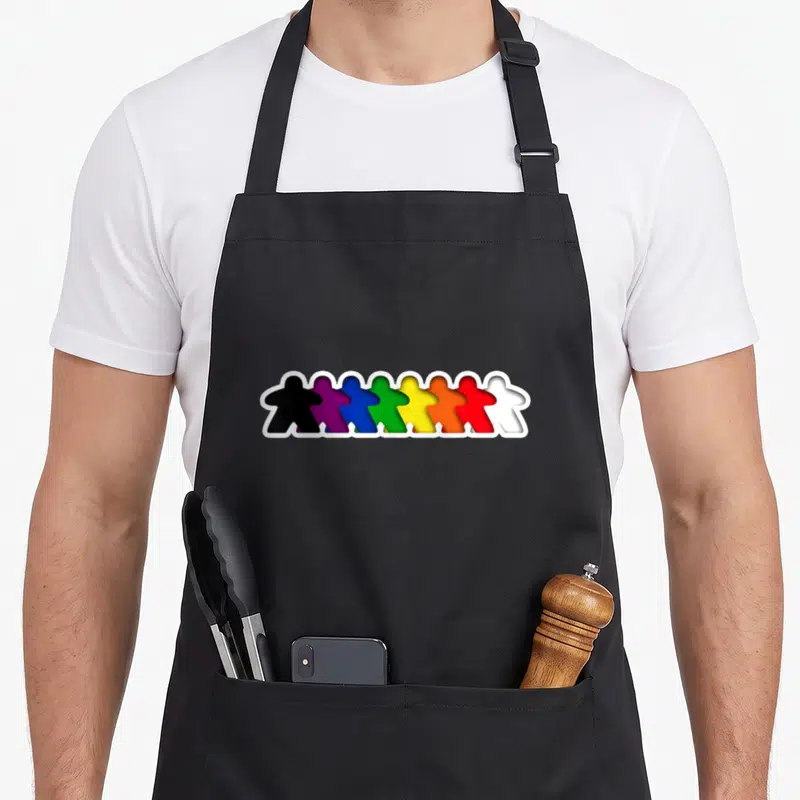 Tablier de cuisine noir avec une rangée de toutes les meeples colorées en arc-en-ciel.