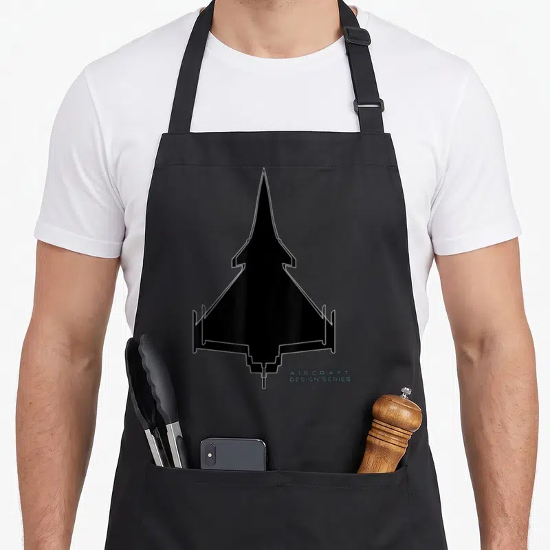 Tablier de cuisine noir avec silhouette Dassault Rafale et texte Aircraft Design Series en bas à droite.