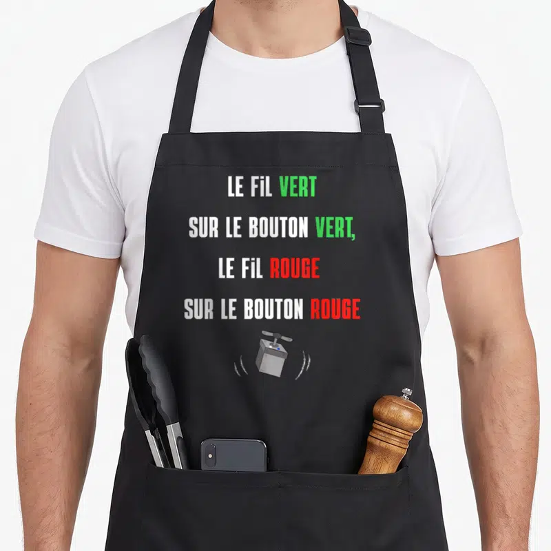 Tablier de cuisine noir avec texte blanc vert et rouge illustrant un bouton poussoir clignotant.