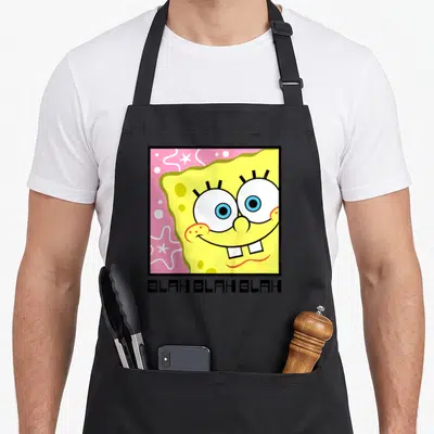 Tablier de cuisine noir avec visage de Bob l'éponge et inscription BLAH BLAH BLAH en bas.