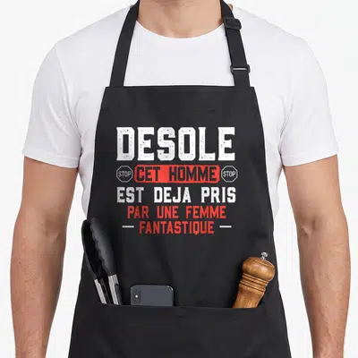 Tablier de cuisine noir avec inscription blanche et rouge désolé cet homme est déjà pris par une femme fantastique.