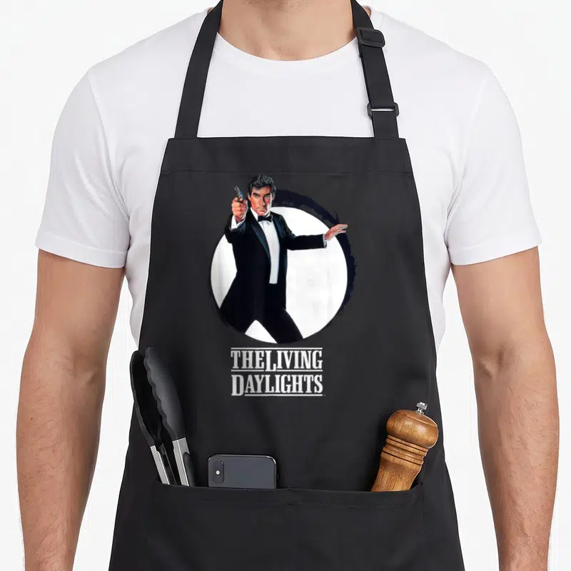 Tablier de cuisine noir avec illustration James Bond 007 et texte The Living Daylights