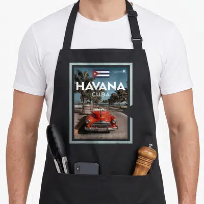 Tablier de cuisine noir avec une illustration d'une voiture rouge à La Havane, Cuba, sous le drapeau national.