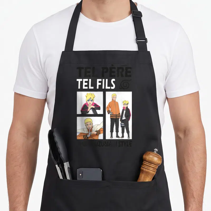 Tablier de cuisine noir avec l'inscription Tel Père Tel Fils et des illustrations de personnages aux cheveux blonds.