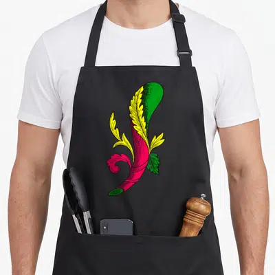 Tablier de cuisine noir avec illustration d'une bannière rose et verte ornée de feuilles jaunes stylisées.