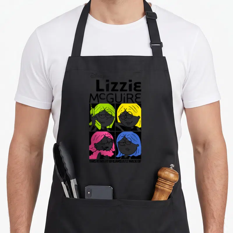 Tablier de cuisine noir avec quatre portraits de Lizzie McGuire aux cheveux verts, jaunes, roses et bleus sous le titre Lizzie McGuire.