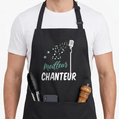 Tablier de cuisine noir avec illustration de microphone blanc et texte Meilleur CHANTEUR en turquoise et blanc.