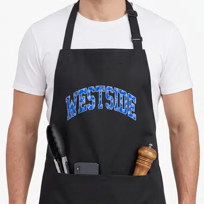 Tablier de cuisine noir avec le mot WESTSIDE en arc, lettres bleues motif bandana blanc.