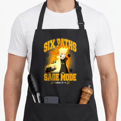 Tablier de cuisine noir avec illustration de Naruto Six Paths Sage Mode et texte orange.