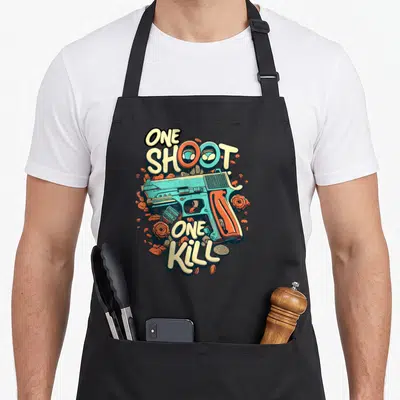 Tablier de cuisine noir avec illustration graffiti d'un pistolet turquoise, des roses oranges et le texte one shoot one kill.