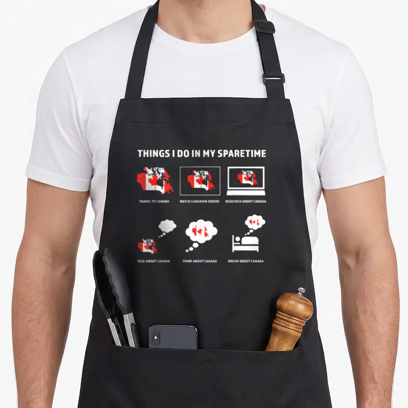 Tablier de cuisine noir avec six illustrations représentant des activités autour du Canada et de son drapeau.
