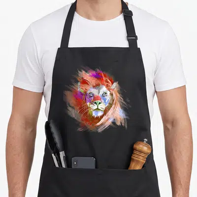 Tablier de cuisine noir avec tête de lion colorée au style peinture abstraite multicolore.