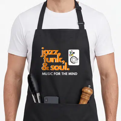 Tablier de cuisine noir avec inscription orange jazz funk et soul et illustration de haut-parleur colorée.