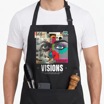 Tablier de cuisine noir avec motif collage artistique représentant des yeux et le texte VISIONS en blanc.