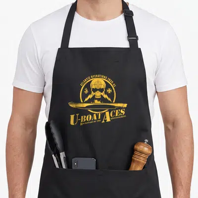 Tablier de cuisine noir avec un logo jaune représentant un crâne, un sous-marin et le texte U-Boat Aces.