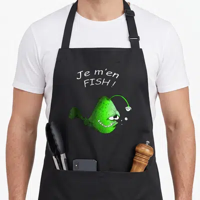 Tablier de cuisine noir avec un poisson angler vert et le texte Je m'en FISH.