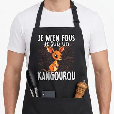 Tablier de cuisine noir avec illustration d'un petit kangourou orange et le texte je m'en fous je suis un kangourou.