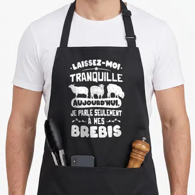 Tablier de cuisine noir avec inscription Laissez-moi tranquille aujourd'hui je parle seulement à mes brebis et trois moutons blancs.