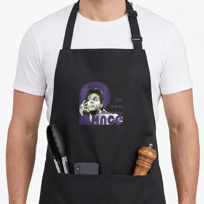 Tablier de cuisine noir avec portrait de Prince et le texte Les Grands Musiciens en violet