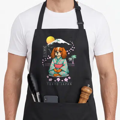 Tablier de cuisine noir avec un chien en kimono vert et katana devant le mont Fuji et des fleurs de sakura.