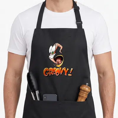 Tablier de cuisine noir avec illustration d'Earthworm Jim et le texte GROOVY en orange.