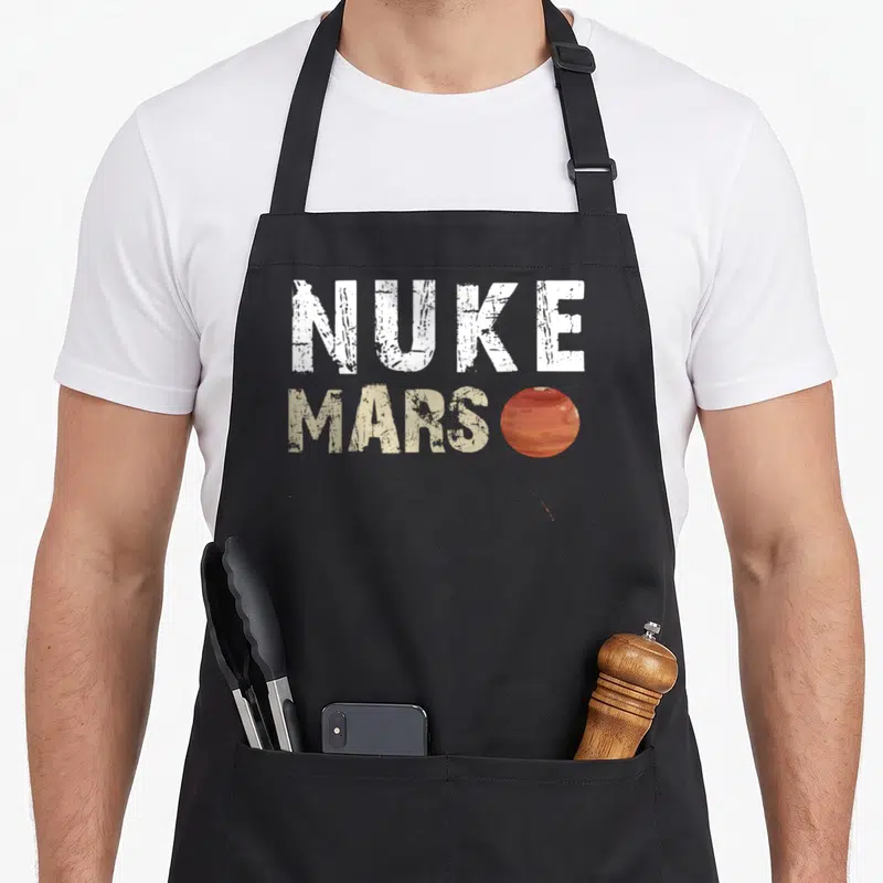 Tablier de cuisine noir avec inscription Nuke Mars et petite planète rouge à côté du mot Mars.