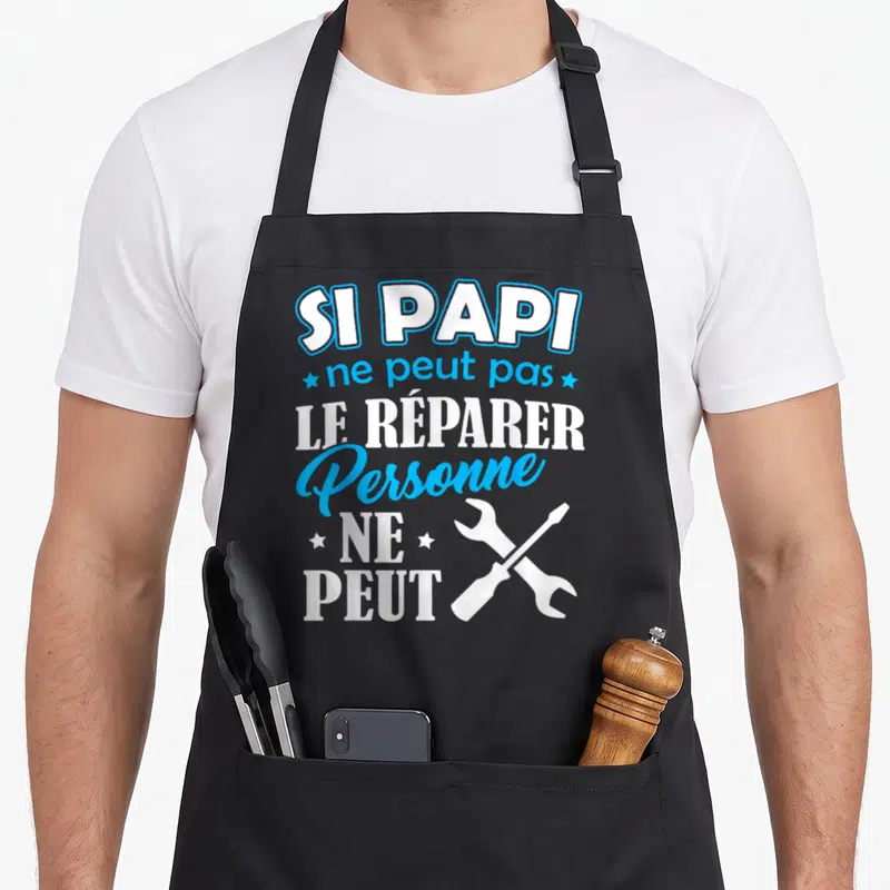 Tablier de cuisine noir avec inscription blanche et bleue Si Papi ne peut pas le réparer personne ne peut et outils croisés.