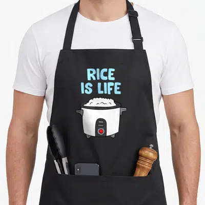 Tablier de cuisine noir avec illustration d'un cuiseur à riz blanc et texte bleu clair