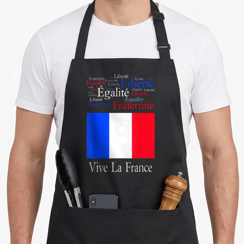 Tablier de cuisine noir avec nuage de mots Liberty et drapeau français tricolore en bas.