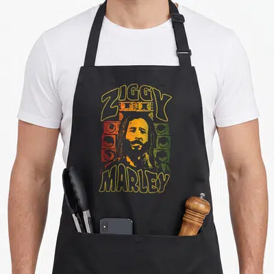 Tablier de cuisine noir avec illustration colorée de Ziggy Marley et sound system