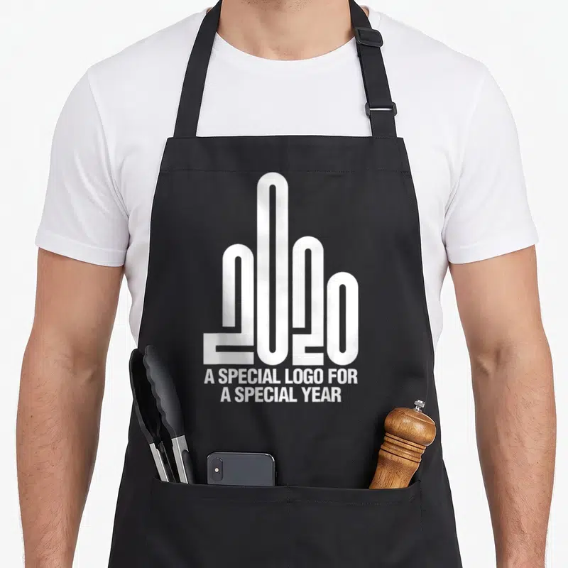Tablier de cuisine noir avec un logo 2020 stylisé en forme de main et le texte A SPECIAL LOGO FOR A SPECIAL YEAR en blanc.