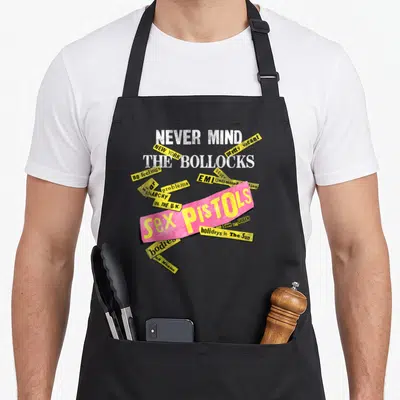 Tablier de cuisine noir avec le motif Never Mind The Bollocks Sex Pistols Anarchy New York EMI en style collage.