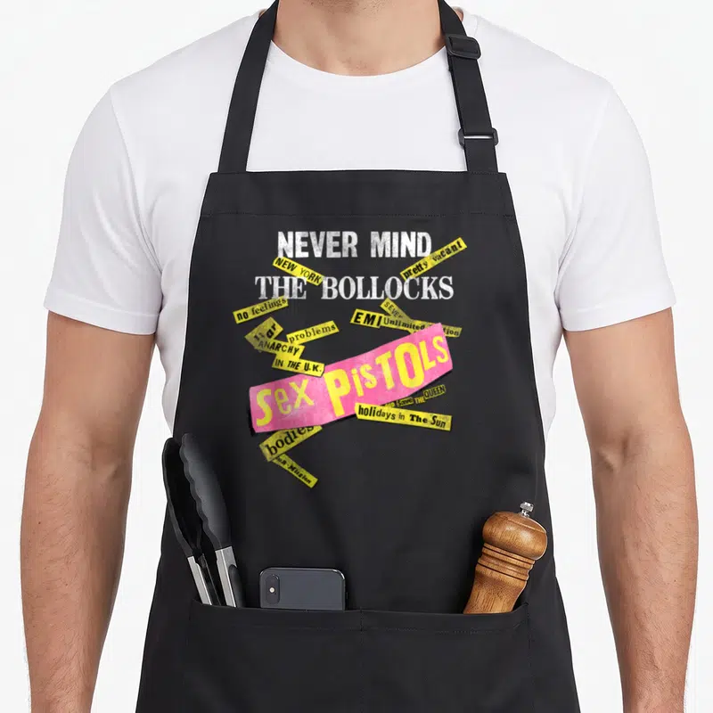 Tablier de cuisine noir avec le motif Never Mind The Bollocks Sex Pistols Anarchy New York EMI en style collage.