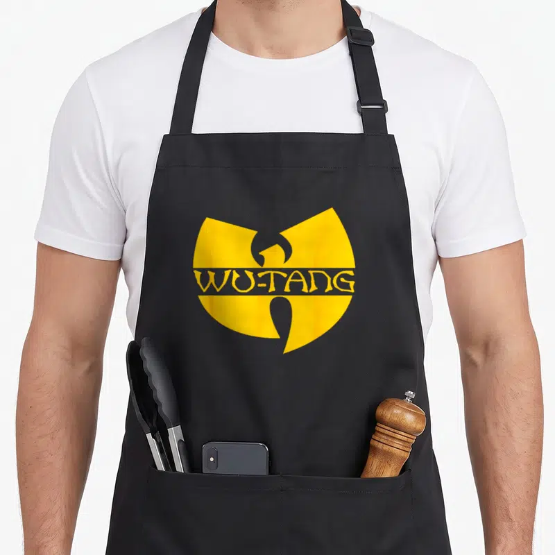 Tablier de cuisine noir avec le symbole Wu-Tang en jaune vif au centre.