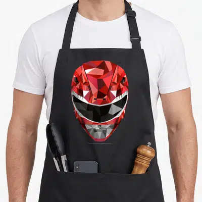 Tablier de cuisine noir avec casque Power Rangers rouge style polygonal géométrique aux facettes vives.