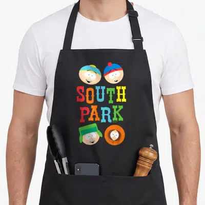 Tablier de cuisine noir avec les visages colorés de Stan, Kyle, Eric et Kenny au-dessus du logo South Park en lettres géantes.